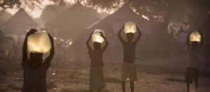 Sudanese refugees carry water provided by Oxfam
